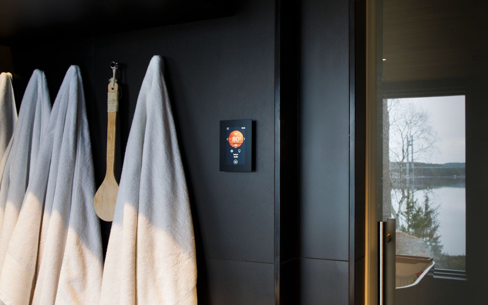 Harvia Wi-Fi control panel on a sauna wall