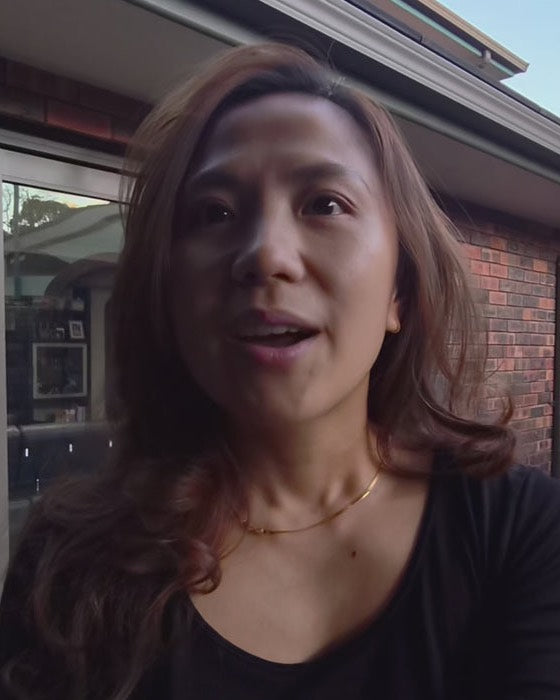 Marcy M talking to camera outside her home